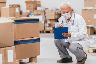 doctor checking medical stick warehouse-GettyImages-1249345137