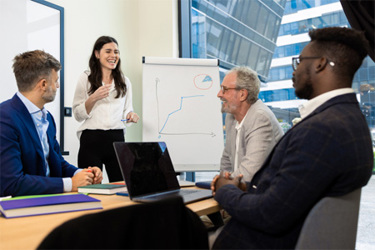 GettyImages-1421387308-partnership-meeting-board-writing