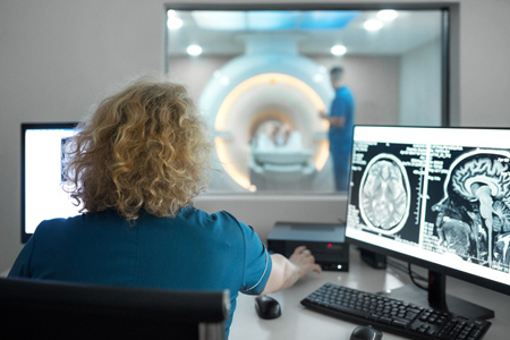 MRI scanning in control room-GettyImages-2176245578