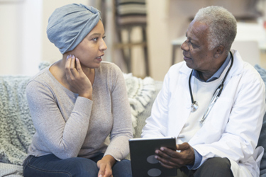 Cancer patient consulting with doctor-GettyImages-1217056000