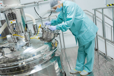 pharmaceutical factory worker sterile environment-GettyImages-934491802