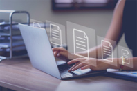 5 Must-Haves For Electronic Batch Records In Life Sciences GettyImages-1640542394-laptop-table-typing-documents