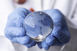 Doctor holding Globe-GettyImages-1978234271