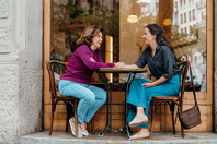 0004_EU---two-women-sitting-at-an-outdoor-cafe-1-(high-res)