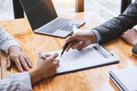 Contracting, signing business investment-GettyImages-1370104932