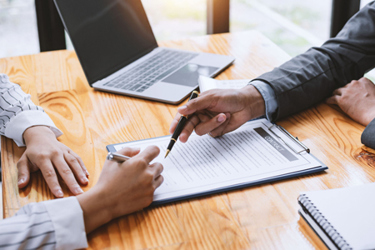 Contracting, signing business investment-GettyImages-1370104932