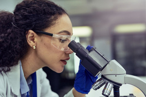 Scientist, laboratory, microscope analysis-GettyImages-1530246394