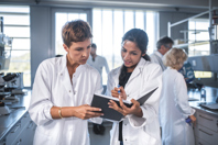 scientists chemists laboratory-GettyImages-1055312560