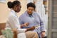 Female Patient Listening to Doctor Holding Tablet-GettyImages-1947527002