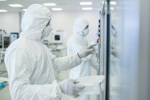 5 Biggest Sterilization Challenges Facing Manufacturers GettyImages-1087218908 In the Manufacturing Facility Team of Scientists Wearing Sterile Protective Coverall