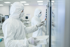 Biologics Manufacturing GettyImages-1087218908 In the Manufacturing Facility Team of Scientists Wearing Sterile Protective Coverall