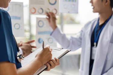 Doctors discussing patient data-GettyImages-2214031965 Doctors discussing patient data-GettyImages-2214031965