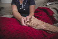 Hospice nurse and patient-GettyImages-895072196