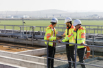 Putting People First: The Human Side Of Digital Transformation Engineers assessing wastewater plant performance GettyImages-1188858012