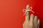 string tied on index finger-GettyImages-1218763850