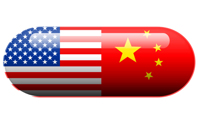 Why Do We Outsource To China? A pill with the Amercan and Chinese flag-iStock-466960795