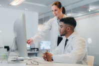 GettyImages-1425605790 Life Sciences Training. Scientists Using A Computer In A Lab