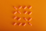 Orange Pills-GettyImages-1404554795