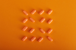 Orange Pills-GettyImages-1404554795