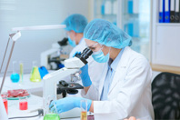 GettyImages-1411964582-scientist-microscope-testing-food-quality