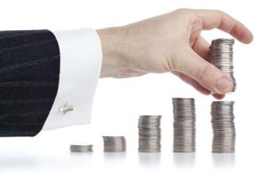 Hand stacking coins-GettyImages-154925362