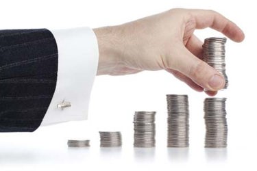 Hand stacking coins-GettyImages-154925362