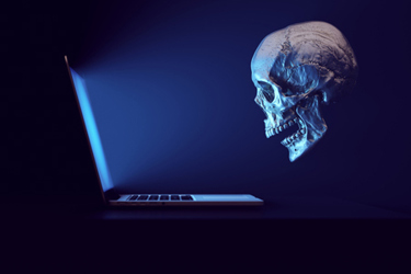 Laptop Skull Safety Danger Anonymous Social Media Bulling Toxic Online Hate-GettyImages-1350171181 Laptop Skull Safety Danger Anonymous Social Media Bulling Toxic Online Hate-GettyImages-1350171181