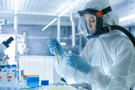 Sterile Fill-Finish Facility: Your Integrated Partner For Customized Clinical Supplies GettyImages-827582436-lab-samples-work-PPE