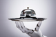 Robot holding service bell-GettyImages-949212002 Robot holding service bell-GettyImages-949212002