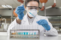 scientist lab test tube pipette iStock-1323987020