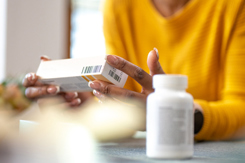 Hands holding medicine box-GettyImages-1475014881