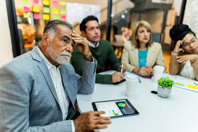 Worried business people in meeting-GettyImages-2151309416
