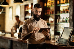 5 Key Factors For A Successful Restaurant POS Reseller Business: An In-Depth Look GettyImages-1212064164 bar server POS
