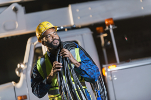 Unveiling The Power Play: Securing Reliability And Resilience In The Utilities Industry GettyImages-637288204 Utility Worker