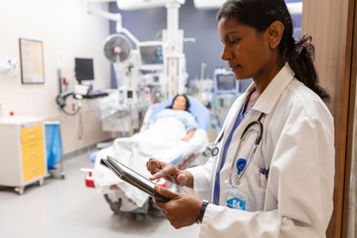 Doctor using tablet in hospital-GettyImages-2227564671
