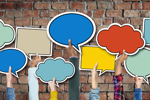 Multi-Ethnic Group of Hands Holding Speech Bubbles iStock-468461332