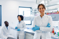 A Guide To Bioprocess Filters GettyImages-2194013542-scientists-smiling-in-lab-discussing