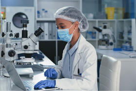 De-Risk Your Drug Development: CMC Manufacturing GettyImages-1327112218 Scientist using a laptop in a laboratory