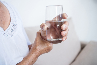 Elderly woman parkinson's disease-GettyImages-2202004725