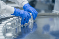 GettyImages-2173467777-vials-pharmaceutical-gloved-hands