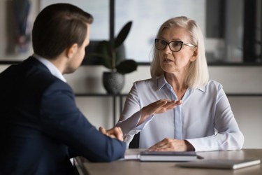explaining work tasks, convince customer to buy services, share information-GettyImages-2193525665