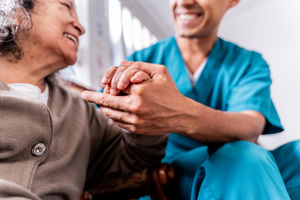 Senior woman with caregiver-GettyImages-2151920853