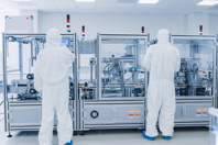 GettyImages-1087219020 Scientists wearing protective coveralls working in manufacturing laboratory