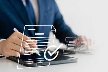 Businessman Using Tablet And Checklists GettyImages-1591153562 Businessman Using Tablet And Checklists GettyImages-1591153562