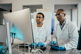GettyImages-2166352840-scientists-in-lab-with-computer-screen