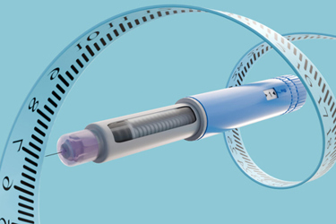 GLP-1 agonist injector pen, medical measuring tape-GettyImages-2226642622