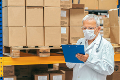 doctor checking medical stock warehouse-GettyImages-1249432480
