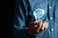From Bottlenecks To Breakthroughs: How AI Is Transforming Translation Timelines GettyImages-1451866321-man-lightbulb-light-ai