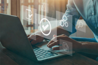 A QMS Software That Enhances Operational Excellence GettyImages-1282633951-laptop-man-suit-office-quality-management