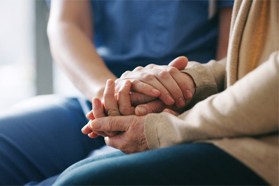 GettyImages-1165981632-holding-hands-nurse-patient